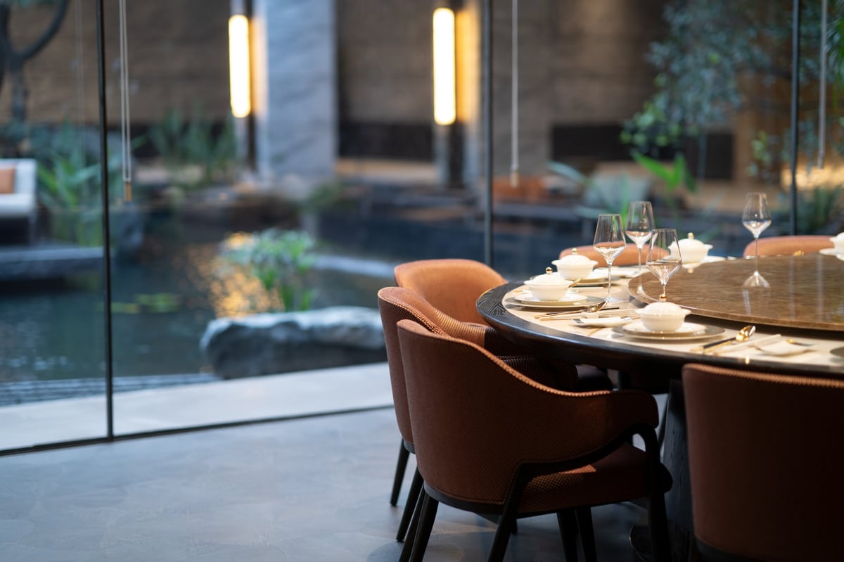 Elegant dining setup by garden view