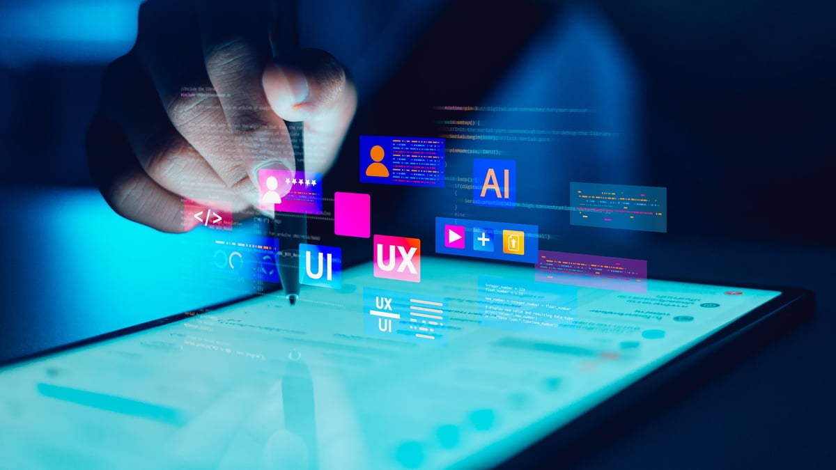 Designer hand using stylus on tablet with UI UX interface icons and AI code. Digital technology and software development concept.
